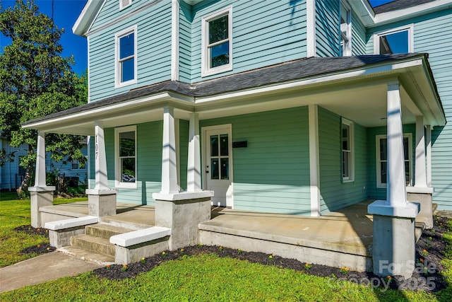 107 Maurice St, Monroe, NC 28112 - view of exterior entry with a shingled roof and covered porch