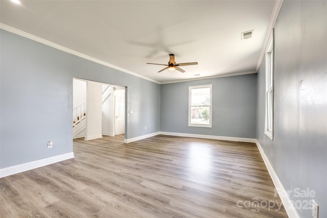 107 Maurice St, Monroe, NC 28112 - spare room featuring wood finished floors, visible vents, ornamental molding, and ceiling fan