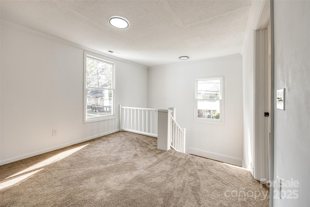 107 Maurice St, Monroe, NC 28112 - carpeted spare room featuring baseboards, a textured ceiling, and crown molding