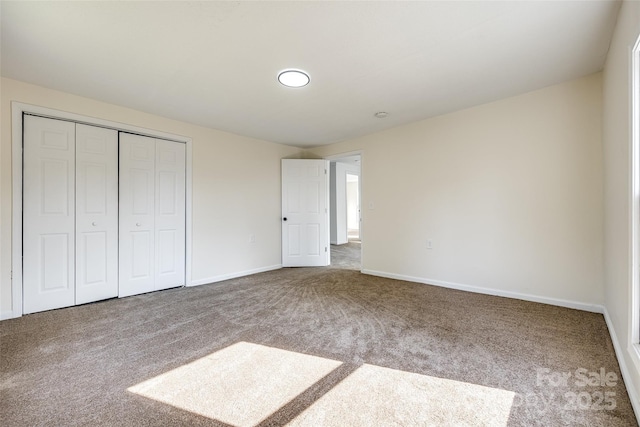 107 Maurice St, Monroe, NC 28112 - unfurnished bedroom featuring a closet, carpet flooring, and baseboards