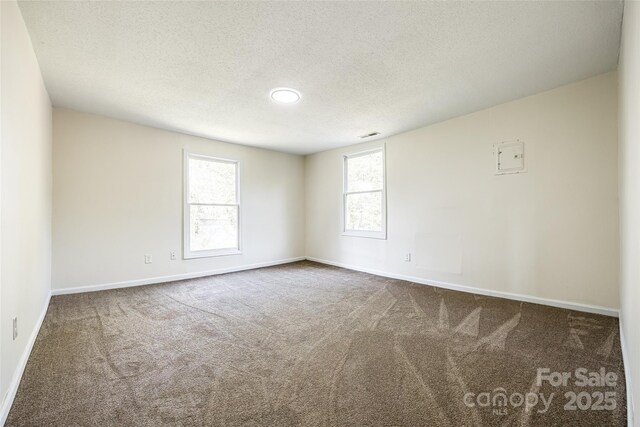 107 Maurice St, Monroe, NC 28112 - empty room featuring carpet floors, baseboards, and a textured ceiling