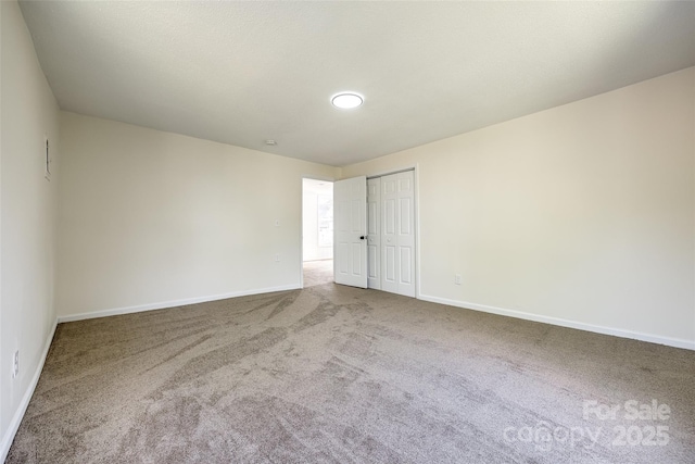 107 Maurice St, Monroe, NC 28112 - carpeted spare room featuring baseboards