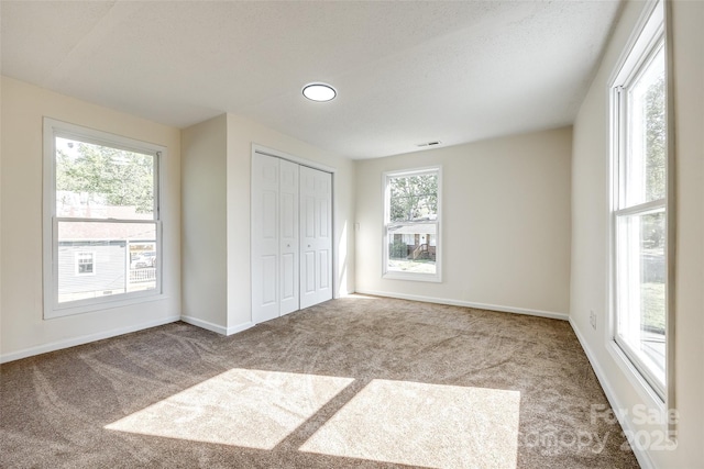 107 Maurice St, Monroe, NC 28112 - unfurnished bedroom featuring carpet floors, baseboards, a closet, and visible vents