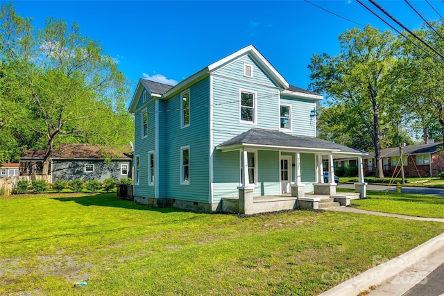 107 Maurice St, Monroe, NC 28112 - view of front of house with a porch, central AC, and a front lawn
