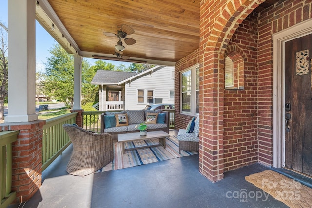 view of patio / terrace with outdoor lounge area, a porch, and a ceiling fan