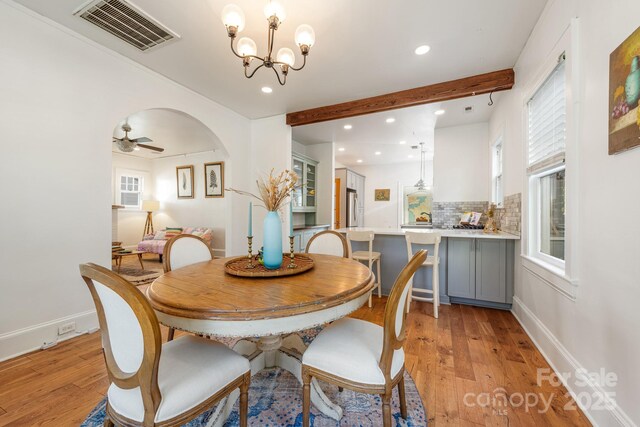 dining area with recessed lighting, visible vents, beamed ceiling, and light wood-style flooring