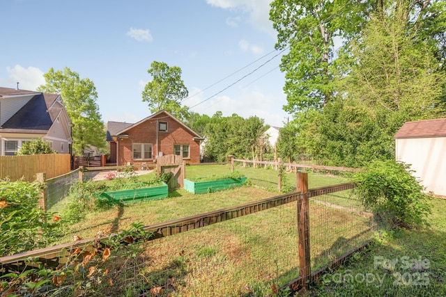 view of yard featuring a garden and fence