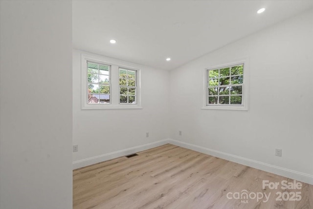 3423 Archer Ave, Charlotte, NC 28217 - spare room with healthy amount of natural light, light wood-style floors, recessed lighting, lofted ceiling, and baseboards