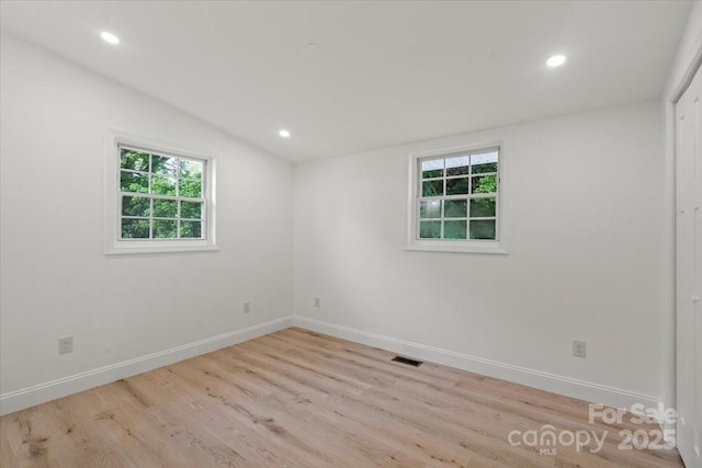 3423 Archer Ave, Charlotte, NC 28217 - spare room featuring light wood-type flooring, baseboards, recessed lighting, and vaulted ceiling