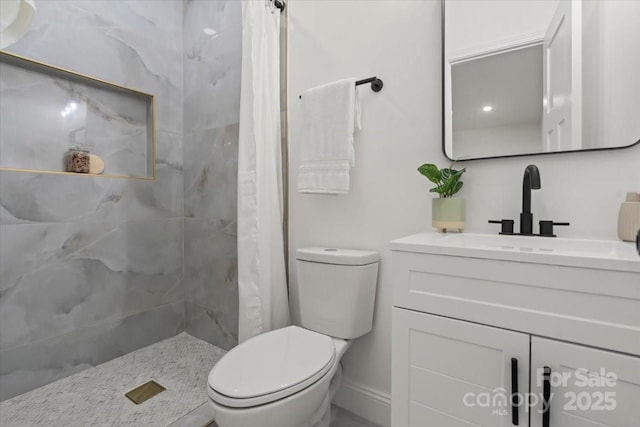3423 Archer Ave, Charlotte, NC 28217 - full bath with vanity, toilet, a tile shower, and baseboards