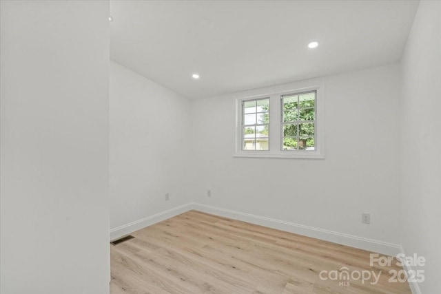 3423 Archer Ave, Charlotte, NC 28217 - spare room featuring baseboards, light wood finished floors, and recessed lighting