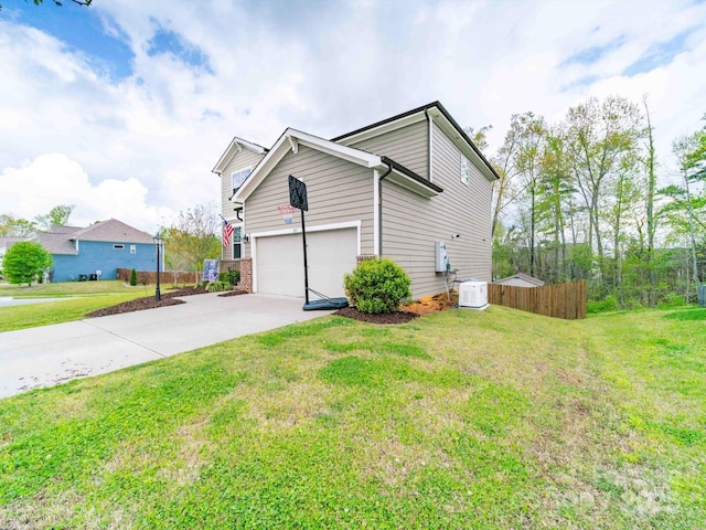 807 Oak Manor Dr SE, Concord, NC 28025 - view of property exterior featuring an attached garage, concrete driveway, fence, and a lawn