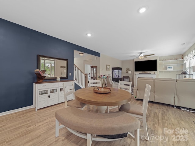 807 Oak Manor Dr SE, Concord, NC 28025 - dining area featuring baseboards, a ceiling fan, light wood-type flooring, recessed lighting, and stairs