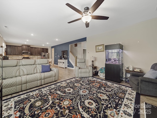 807 Oak Manor Dr SE, Concord, NC 28025 - living area featuring recessed lighting, light wood-type flooring, stairs, and ceiling fan