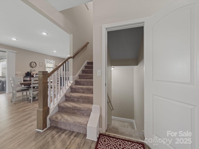 807 Oak Manor Dr SE, Concord, NC 28025 - stairway with wood finished floors, baseboards, and recessed lighting