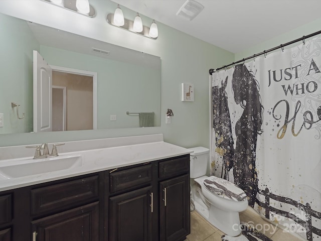807 Oak Manor Dr SE, Concord, NC 28025 - bathroom featuring tile patterned floors, vanity, visible vents, and toilet