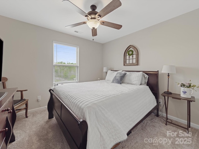 807 Oak Manor Dr SE, Concord, NC 28025 - bedroom with light carpet, visible vents, baseboards, and ceiling fan