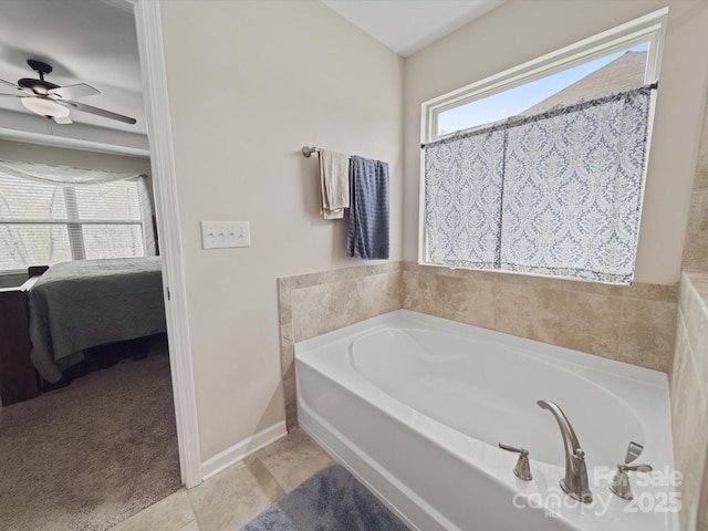 807 Oak Manor Dr SE, Concord, NC 28025 - full bathroom with a garden tub, ceiling fan, ensuite bath, tile patterned flooring, and baseboards