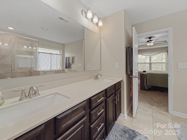 807 Oak Manor Dr SE, Concord, NC 28025 - ensuite bathroom featuring tile patterned floors, a healthy amount of sunlight, a sink, and visible vents