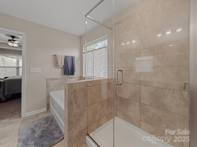 807 Oak Manor Dr SE, Concord, NC 28025 - full bath featuring baseboards, a ceiling fan, a shower stall, ensuite bath, and a garden tub