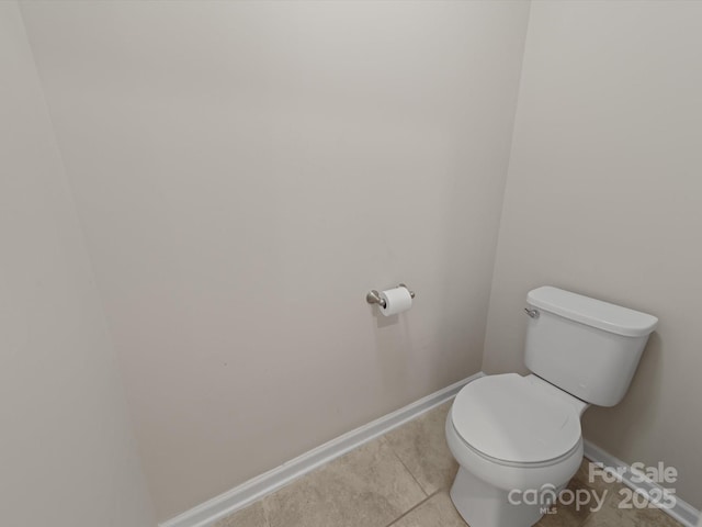 807 Oak Manor Dr SE, Concord, NC 28025 - bathroom featuring toilet, tile patterned flooring, and baseboards