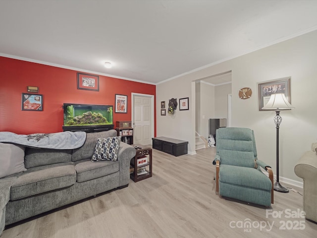 807 Oak Manor Dr SE, Concord, NC 28025 - living room featuring stairs, light wood-style flooring, baseboards, and ornamental molding
