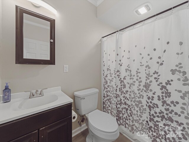 807 Oak Manor Dr SE, Concord, NC 28025 - bathroom with toilet, crown molding, vanity, and visible vents