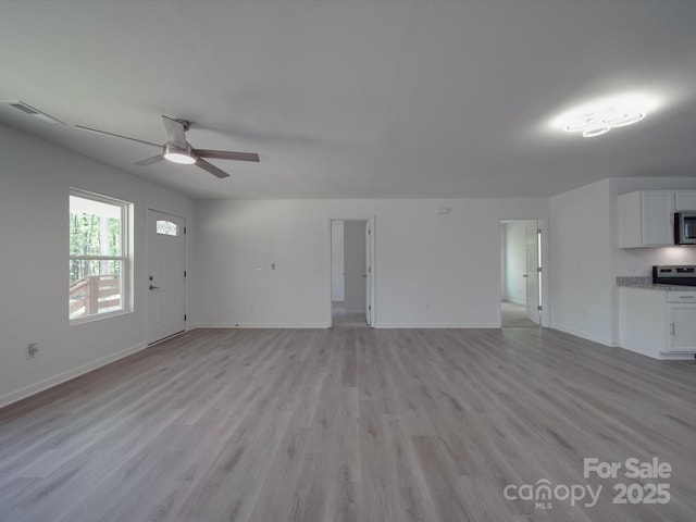 1241 Pitts Rd, Chester, SC 29706 - unfurnished living room with light wood finished floors, baseboards, ceiling fan, and visible vents