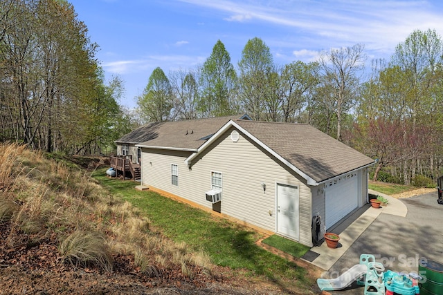 54 Golddigger Dr, Candler, NC 28715 - view of side of home featuring roof with shingles and a garage