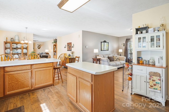 54 Golddigger Dr, Candler, NC 28715 - kitchen with a textured ceiling, open floor plan, and light wood-style floors
