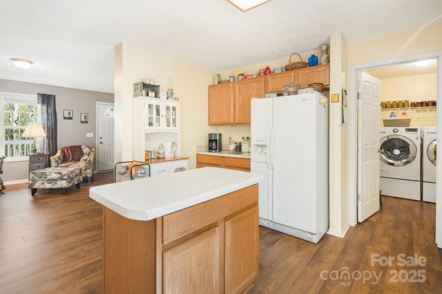 54 Golddigger Dr, Candler, NC 28715 - kitchen with white refrigerator with ice dispenser, separate washer and dryer, a center island, and dark wood-style floors