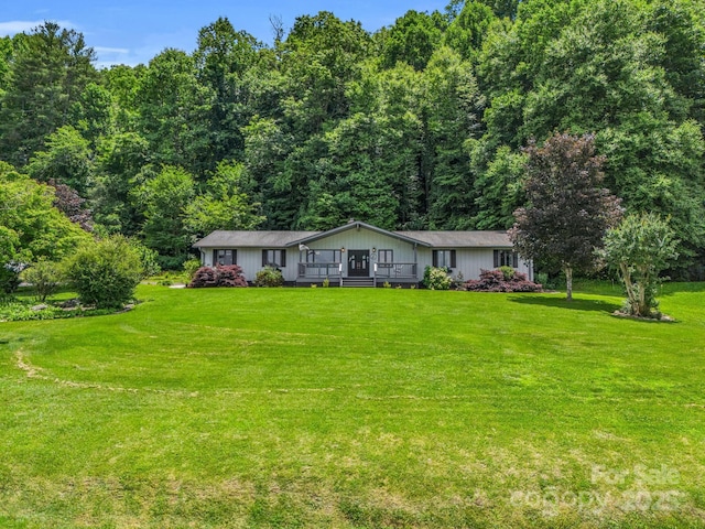 ranch-style home with a front lawn