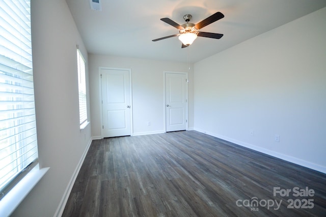 52 Cain Hollow Way, Asheville, NC 28806 - unfurnished bedroom with ceiling fan, baseboards, dark wood-type flooring, and visible vents