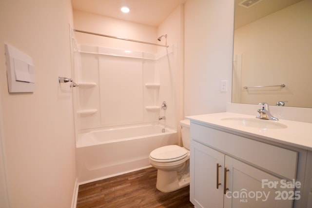 52 Cain Hollow Way, Asheville, NC 28806 - bathroom with toilet, shower / bathing tub combination, recessed lighting, wood finished floors, and vanity