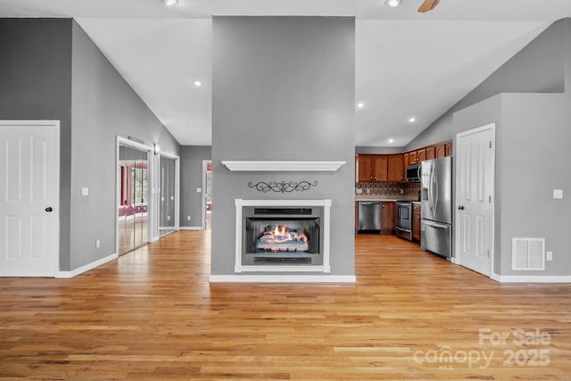 kitchen featuring visible vents, open floor plan, light wood-style floors, recessed lighting, and stainless steel appliances