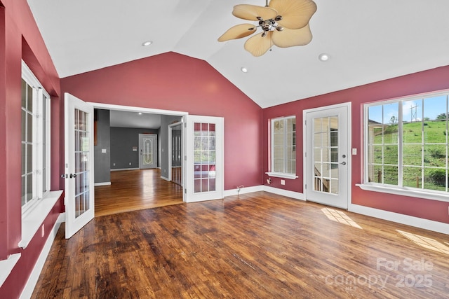 unfurnished room featuring french doors, ceiling fan, wood finished floors, and lofted ceiling
