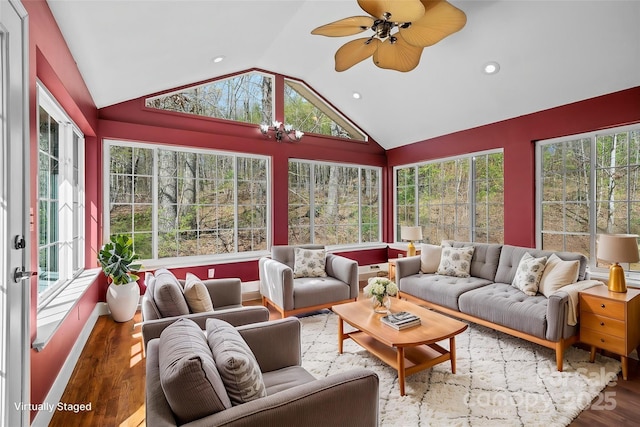 sunroom with a chandelier, recessed lighting, wood finished floors, french doors, and lofted ceiling
