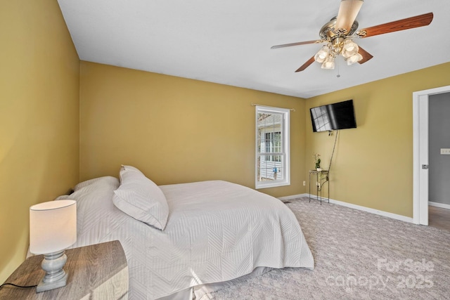 carpeted bedroom with baseboards and ceiling fan