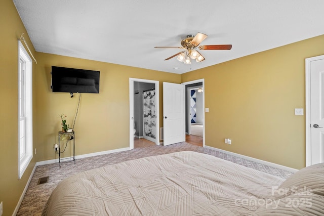 bedroom featuring ceiling fan, light colored carpet, baseboards, and visible vents