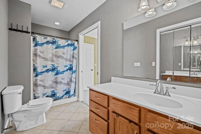 bathroom with visible vents, a shower with shower curtain, toilet, vanity, and tile patterned flooring