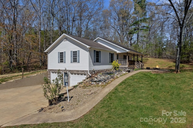 view of front facade featuring an attached garage, covered porch, a front lawn, and concrete driveway