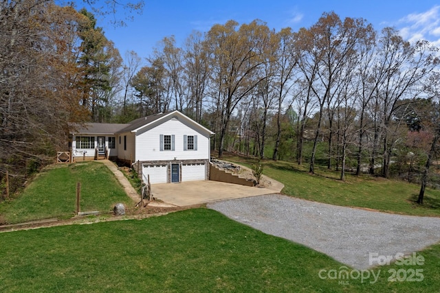 exterior space featuring a front yard, a garage, and driveway