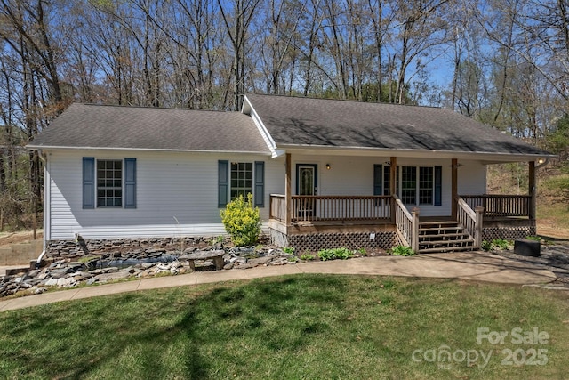 single story home with roof with shingles, a porch, and a front yard