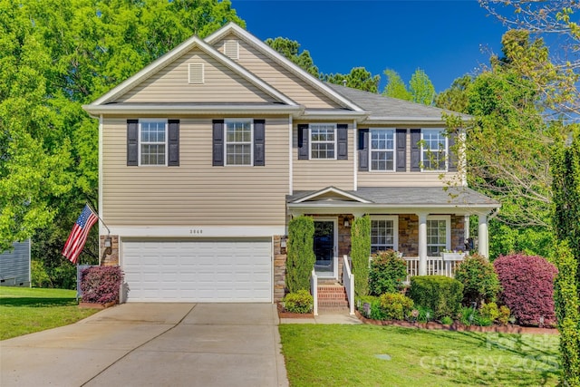 3040 Sunshower Hts, York, SC 29745 - craftsman-style home featuring concrete driveway, a front lawn, stone siding, covered porch, and an attached garage