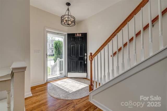 3040 Sunshower Hts, York, SC 29745 - foyer featuring stairs, a notable chandelier, wood finished floors, and baseboards