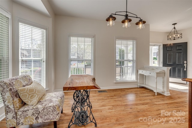 3040 Sunshower Hts, York, SC 29745 - dining area with a chandelier, light wood-style floors, visible vents, and baseboards