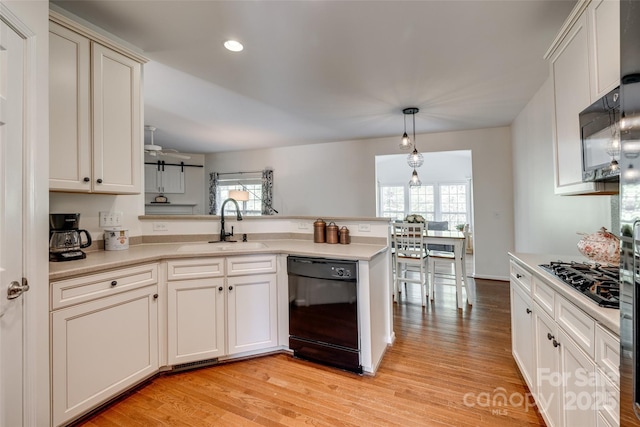 3040 Sunshower Hts, York, SC 29745 - kitchen featuring black appliances, a peninsula, a sink, and light countertops