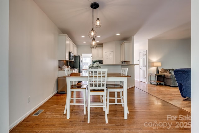 3040 Sunshower Hts, York, SC 29745 - dining area with light wood-style floors, visible vents, and baseboards