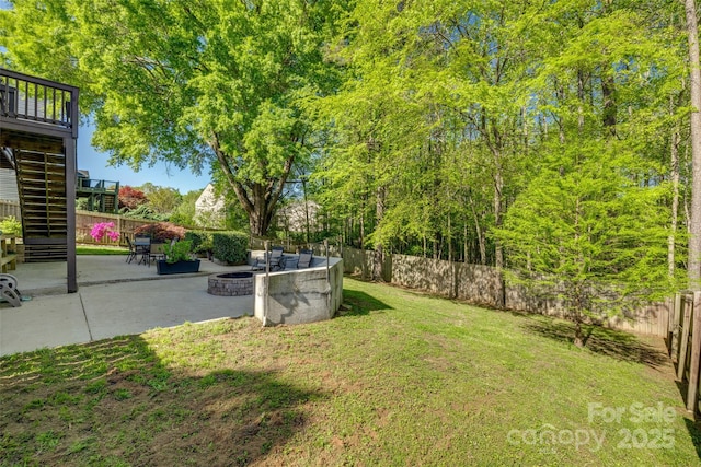 3040 Sunshower Hts, York, SC 29745 - view of yard featuring stairway, a fenced backyard, a wooden deck, a patio, and an outdoor fire pit