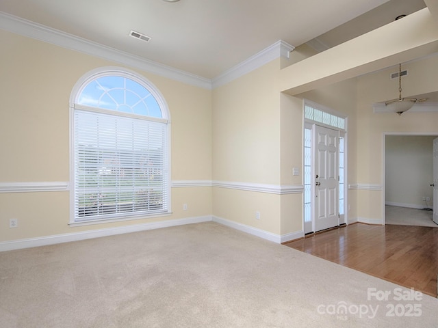126 Dairy Farm Rd, Mooresville, NC 28115 - carpeted spare room with crown molding, a healthy amount of sunlight, baseboards, and visible vents